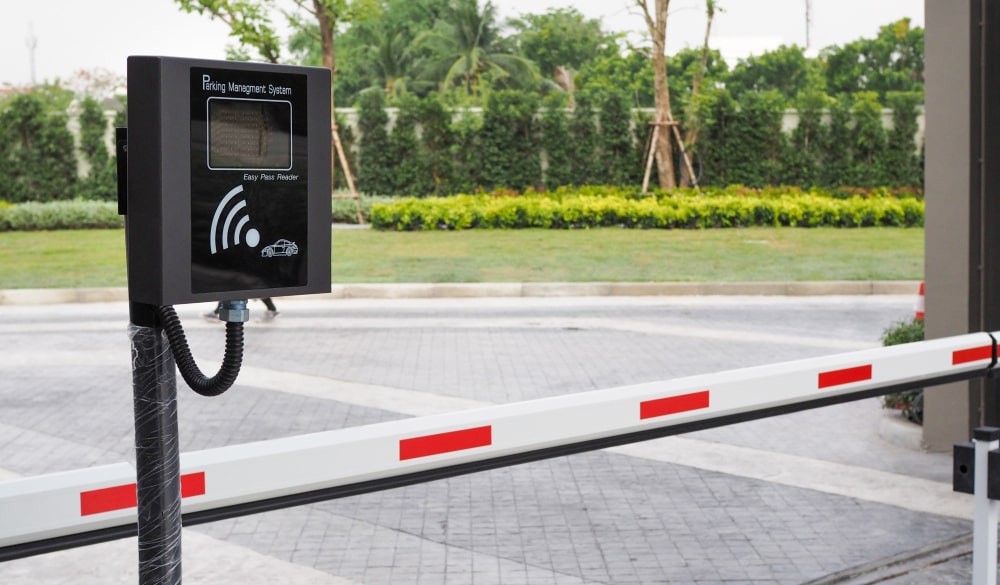 Automatic boom barrier with RFID reader at a parking entrance