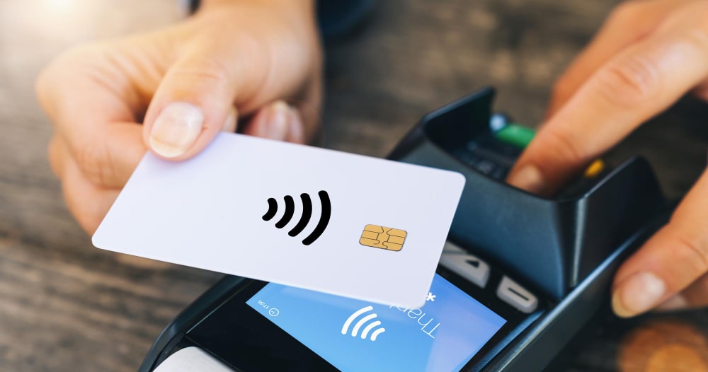 Contactless RFID card held to a reader terminal